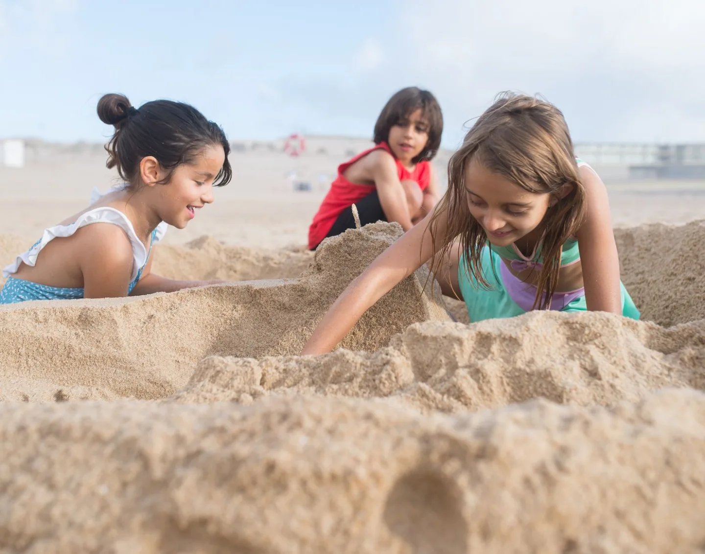 Children digging and building in the sand